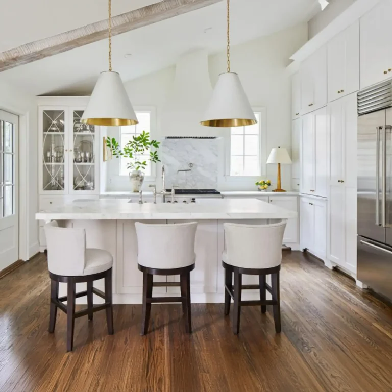 Modern kitchen renovation in Vaughan featuring white shaker cabinets, a gray quartz island, and pendant lighting over the breakfast bar